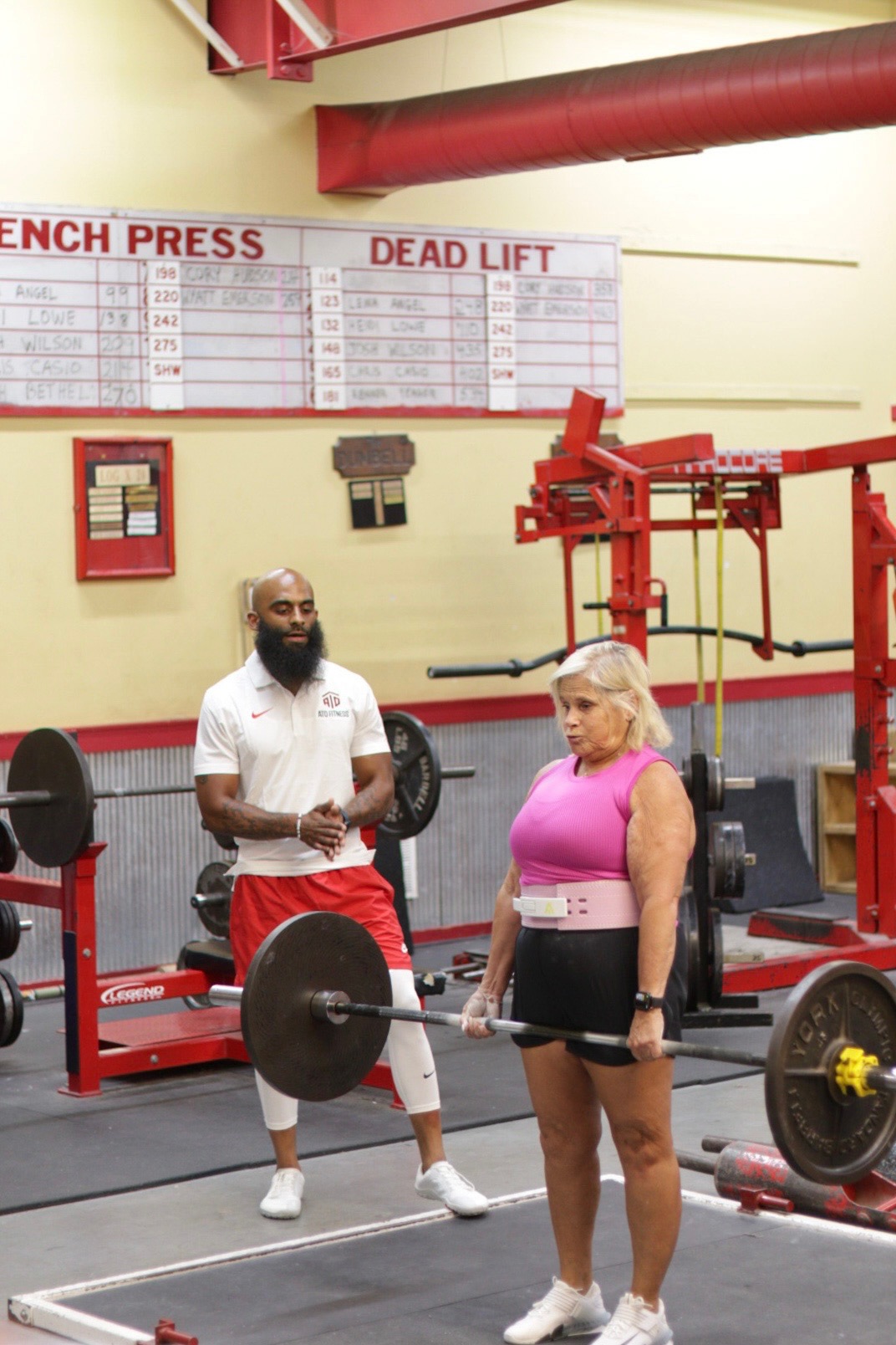 Coach T coaching a deadlift setup