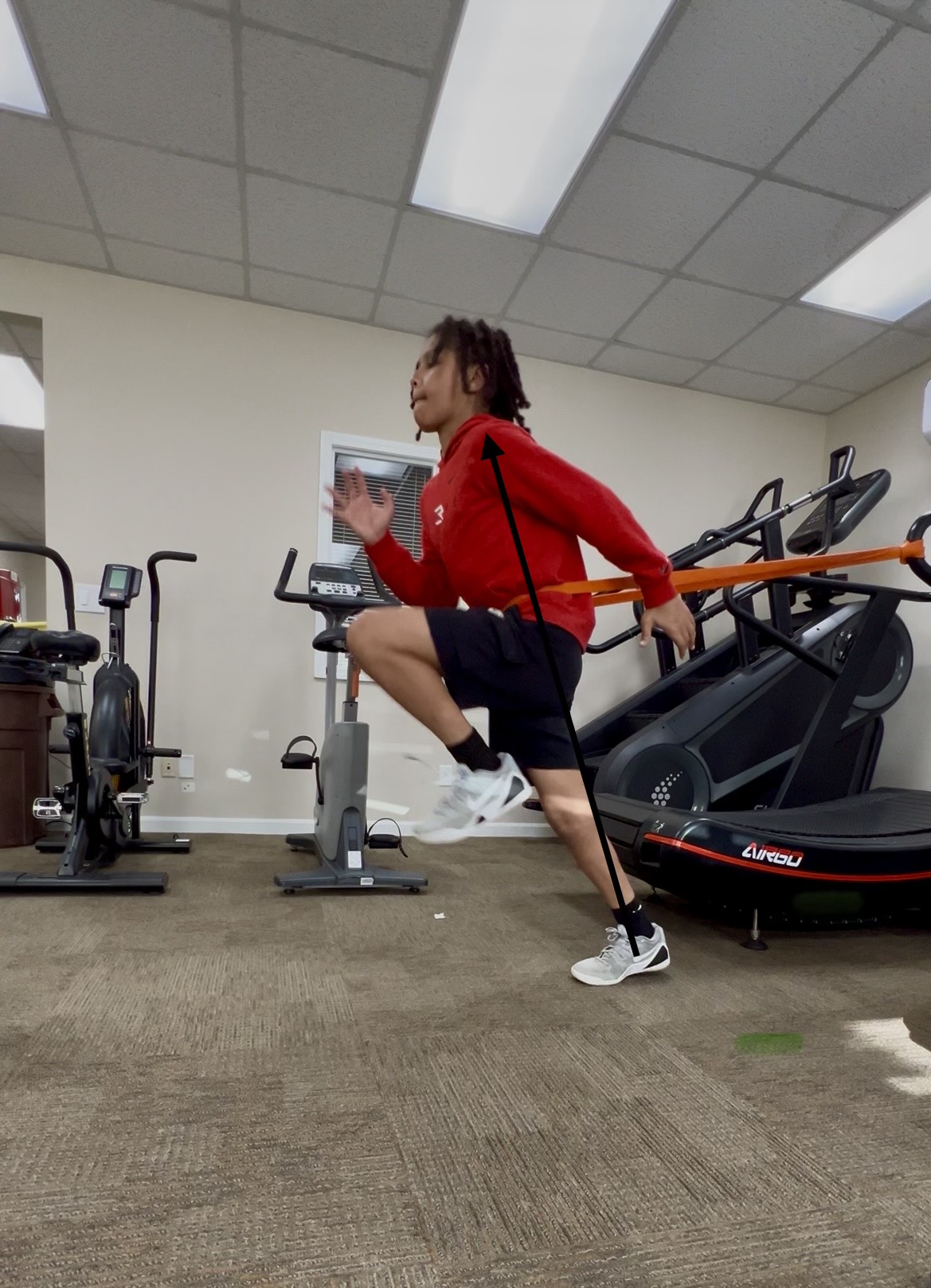 Athlete performing resisted band sprints