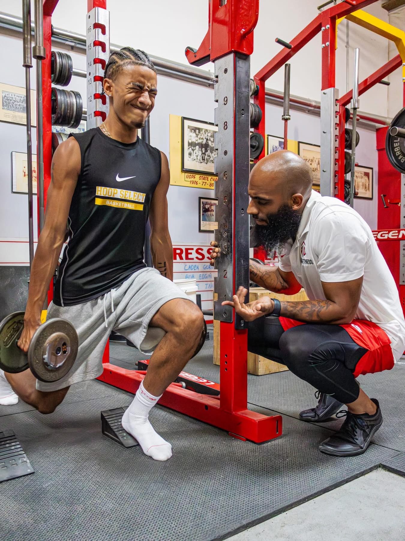 Coach T coaching a Bulgarian split squat